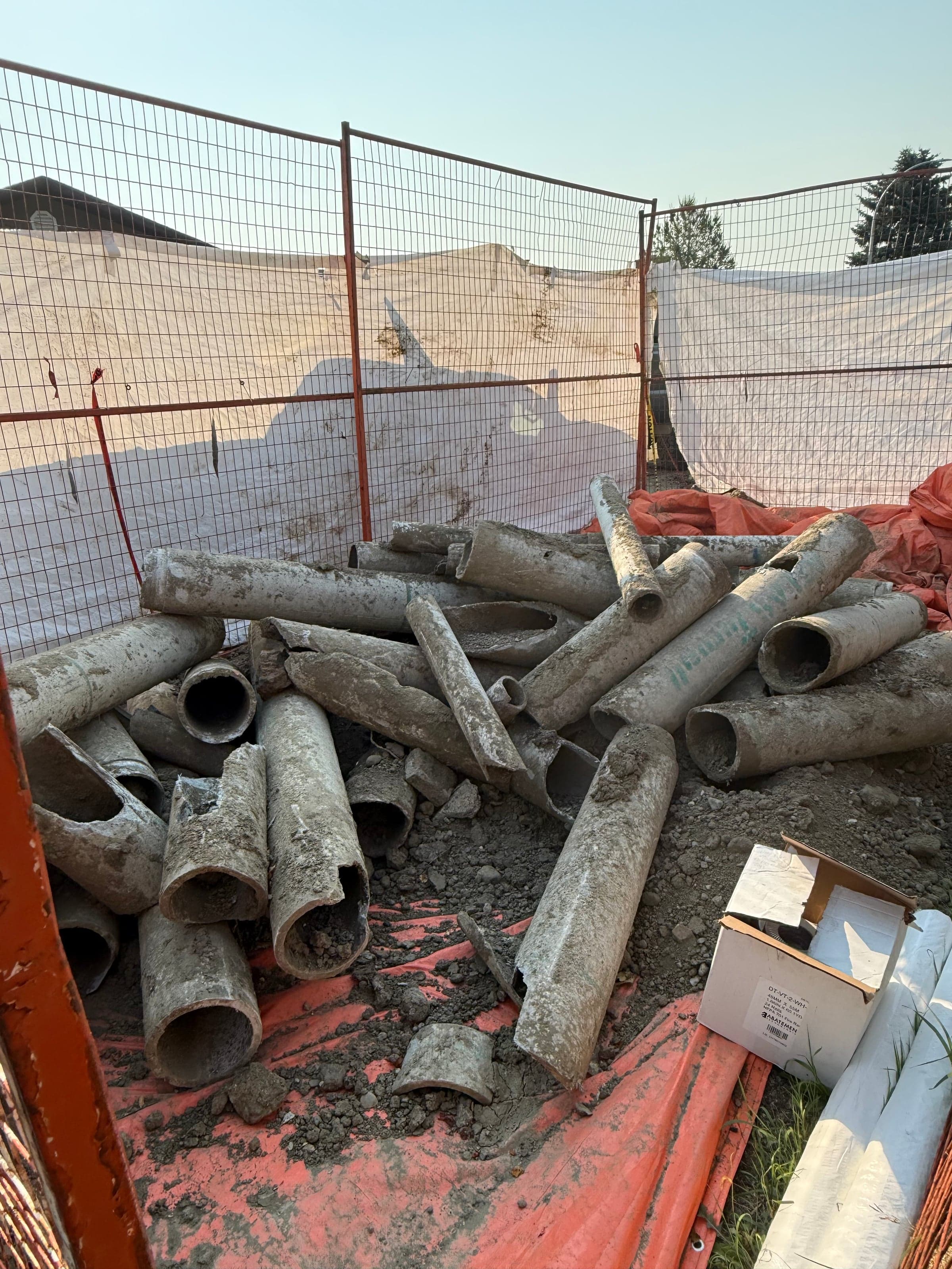 ACM asbestos pipe removed on an Aztec Calgary job site